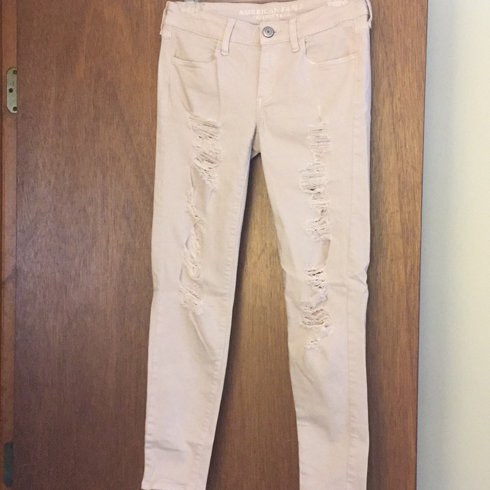 American Eagle distressed light pink jeans